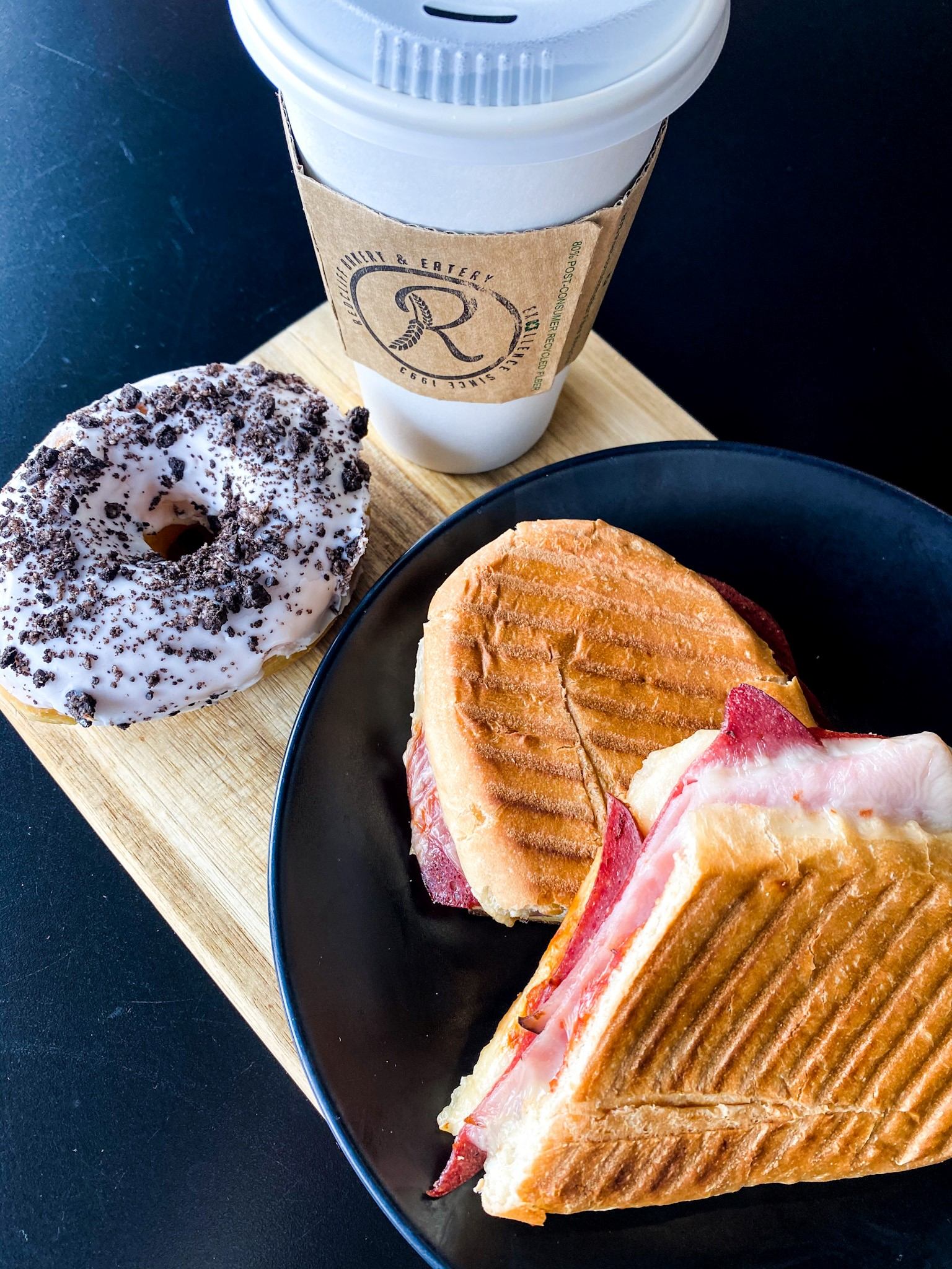 Panini, donut, and coffee from Redcliff Bakery