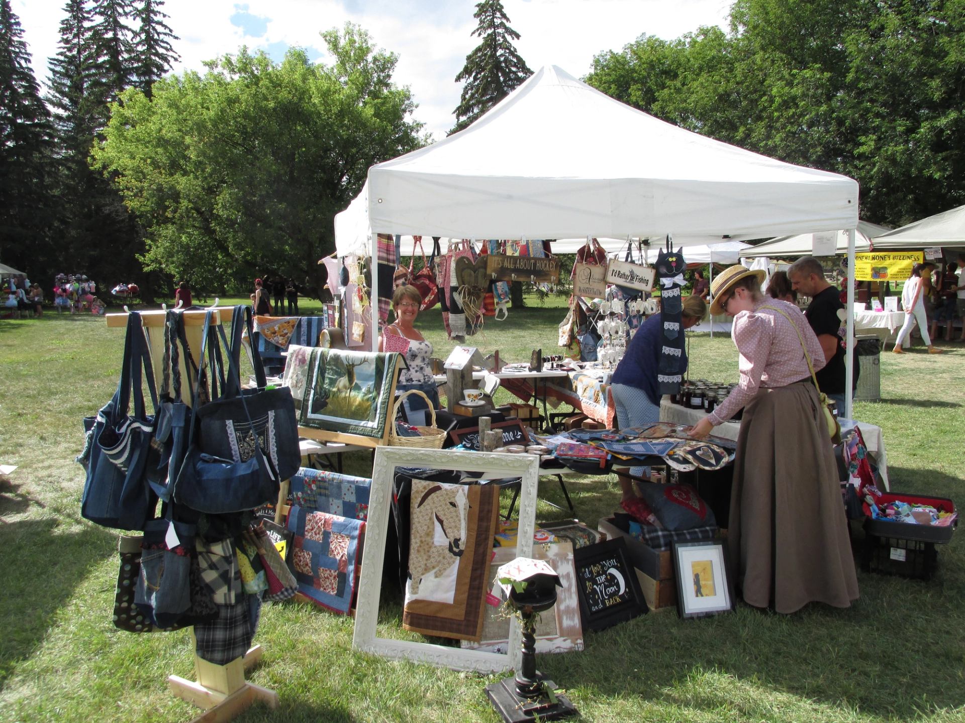 Outdoor market stall with crafts and goods at Historic Dunvegan.