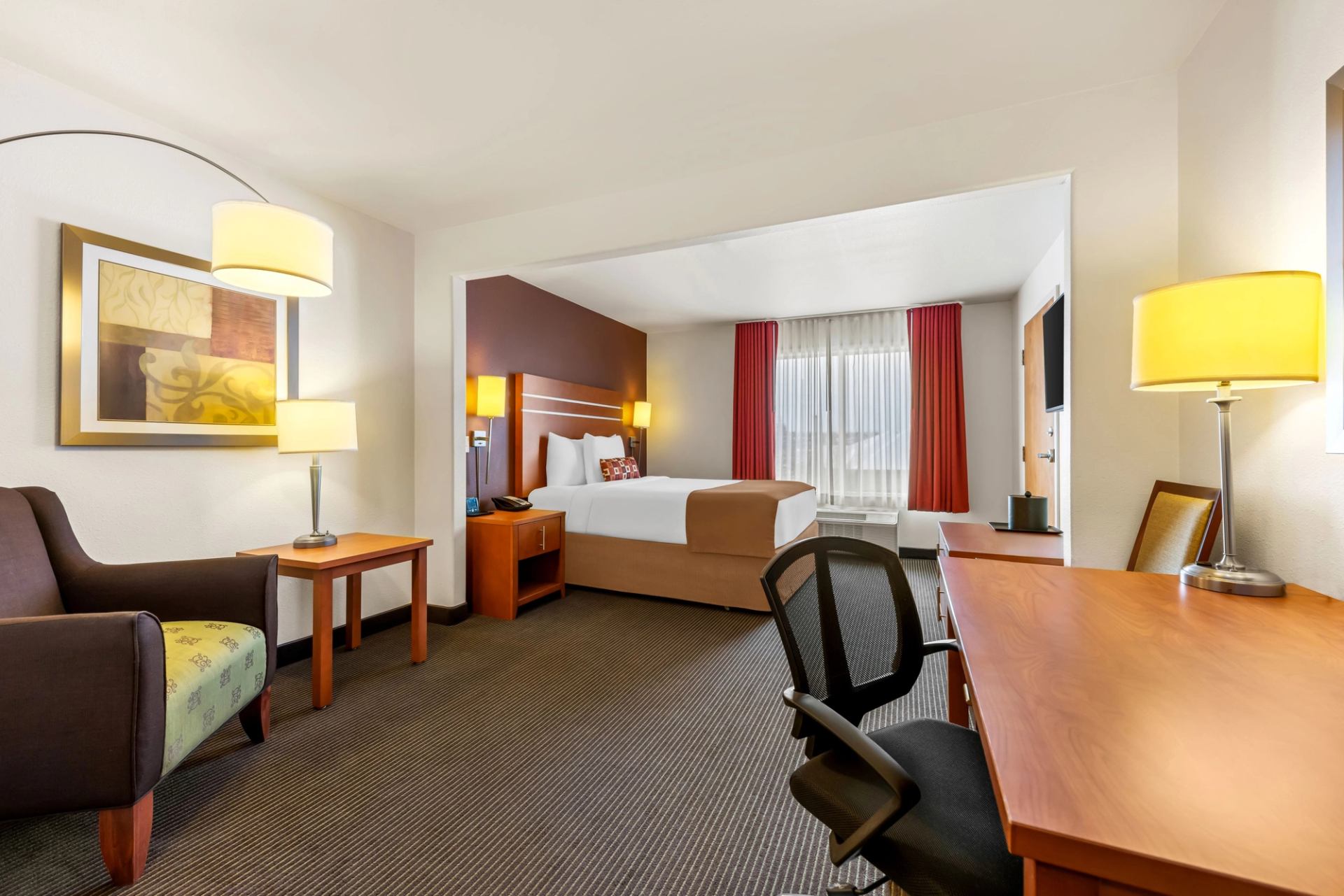 Interior of a king bedroom Wingate by Wyndham Calgary.