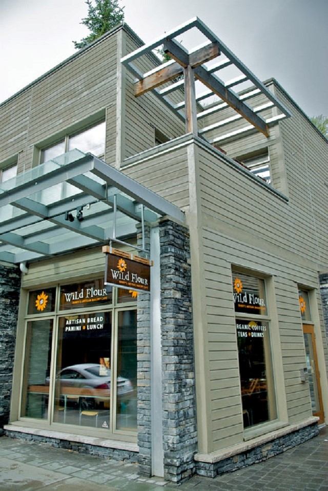 Exterior view of Wild Flour Bakery with modern design and stone accents.