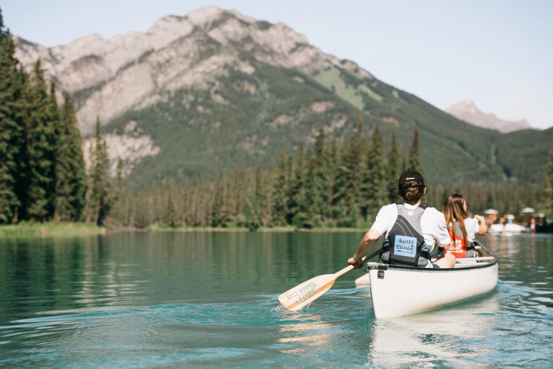 Two people rowing a canoe