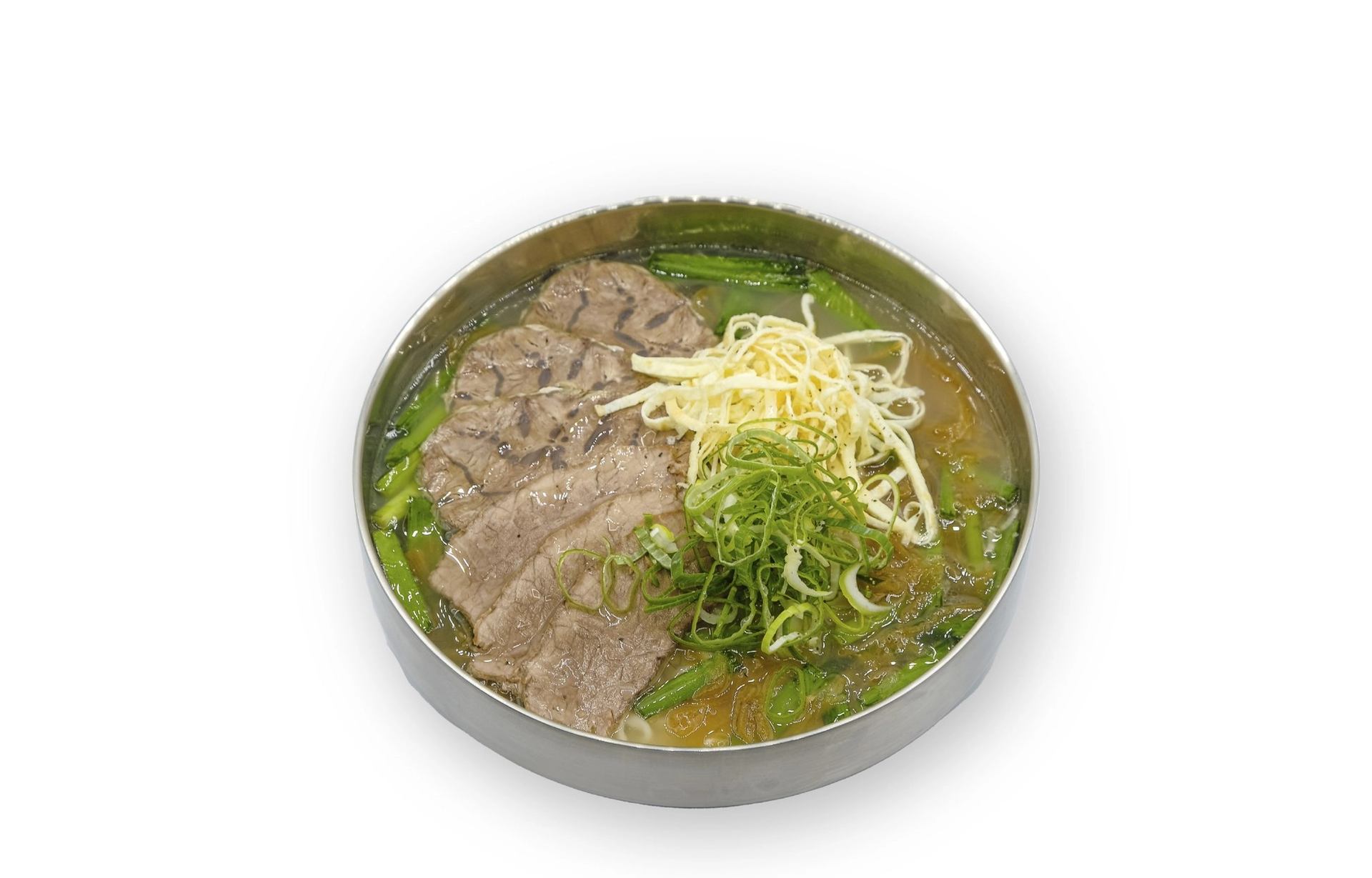 Beef kalguksu bowl with sliced brisket, shank, noodles, and vegetables in broth.
