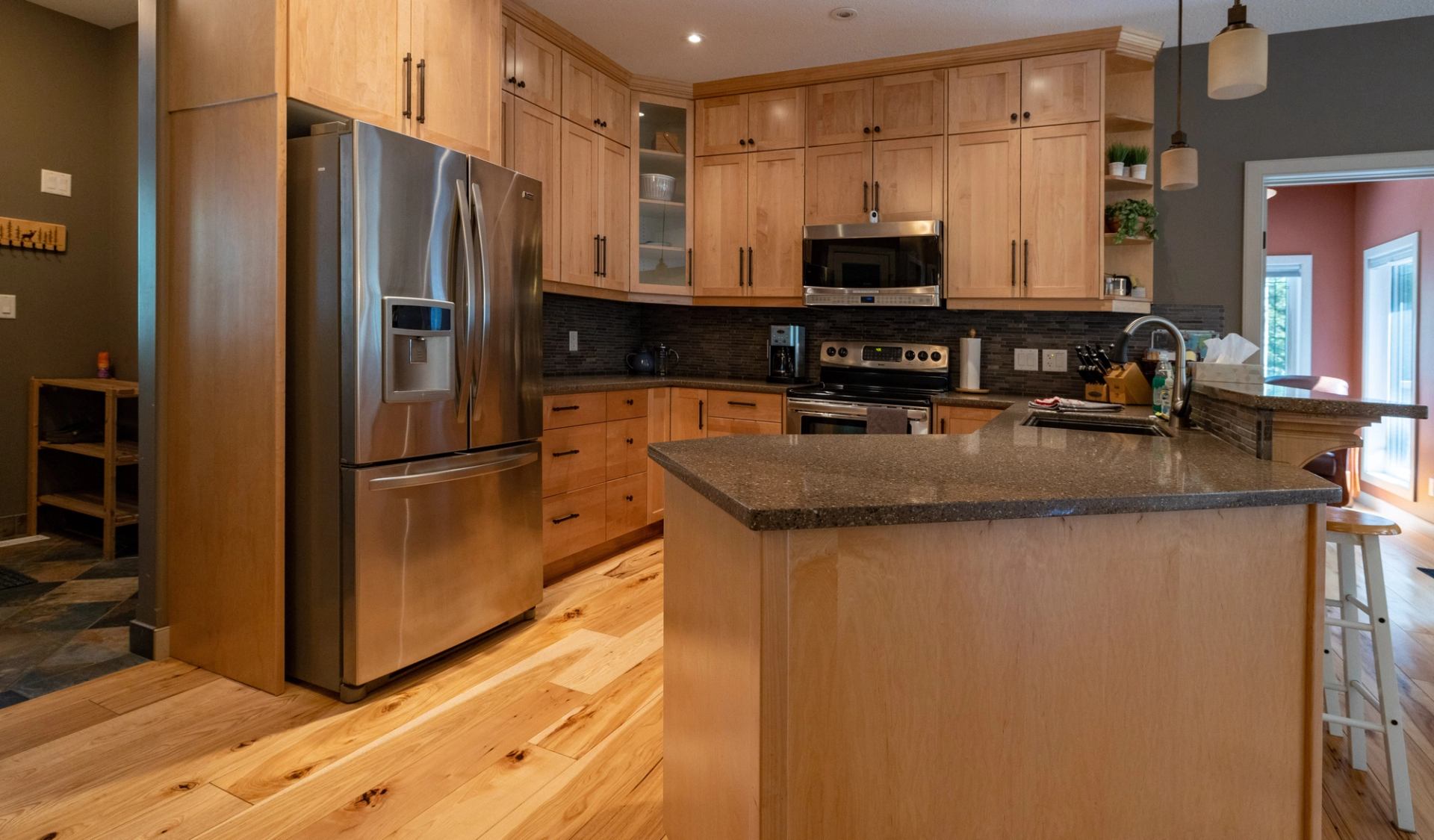 Modern kitchen with wood cabinets and island.