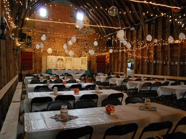 Tables set for dining in Windy Rafters Barn