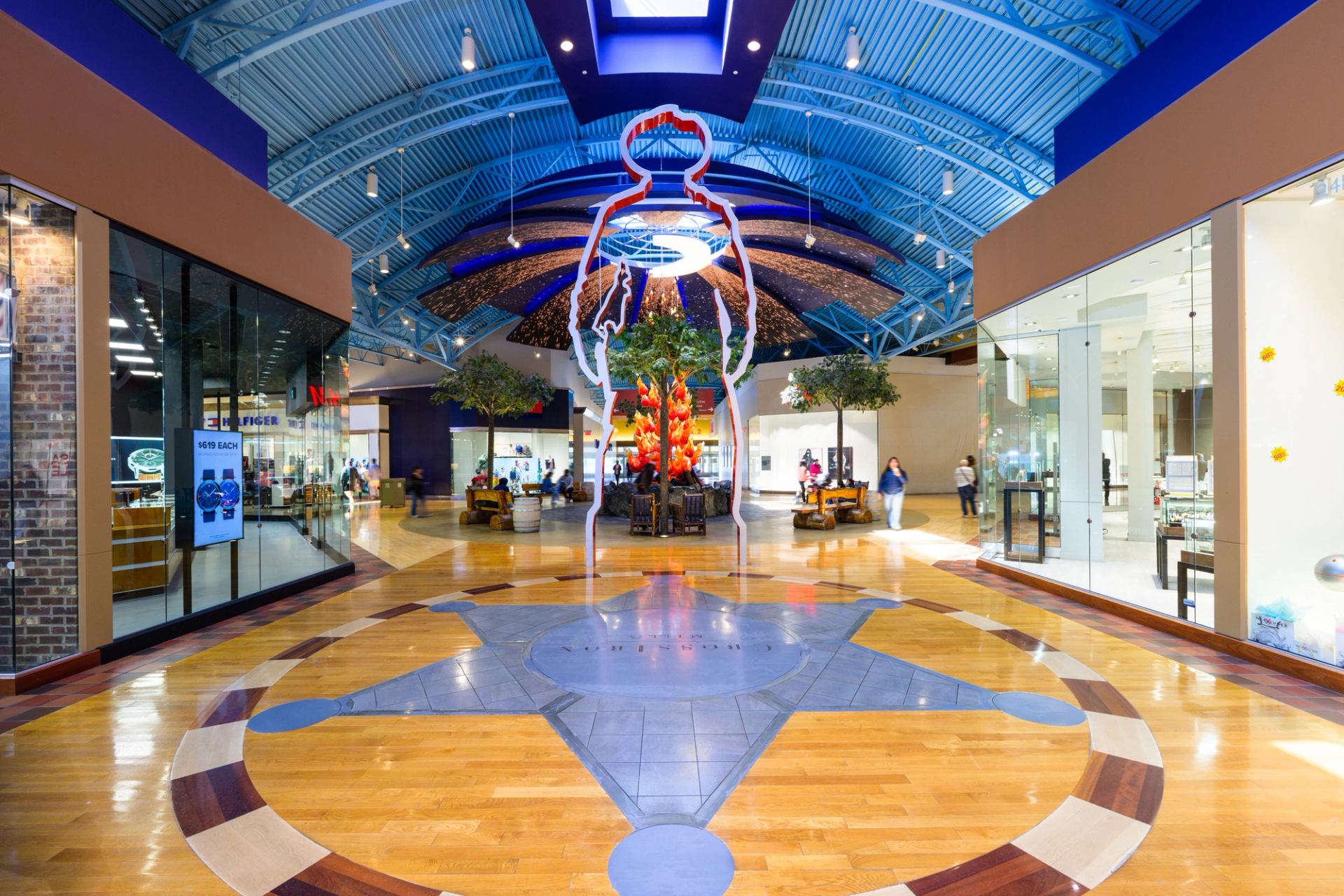 Colorful ceiling and shops inside CrossIron Mills mall.