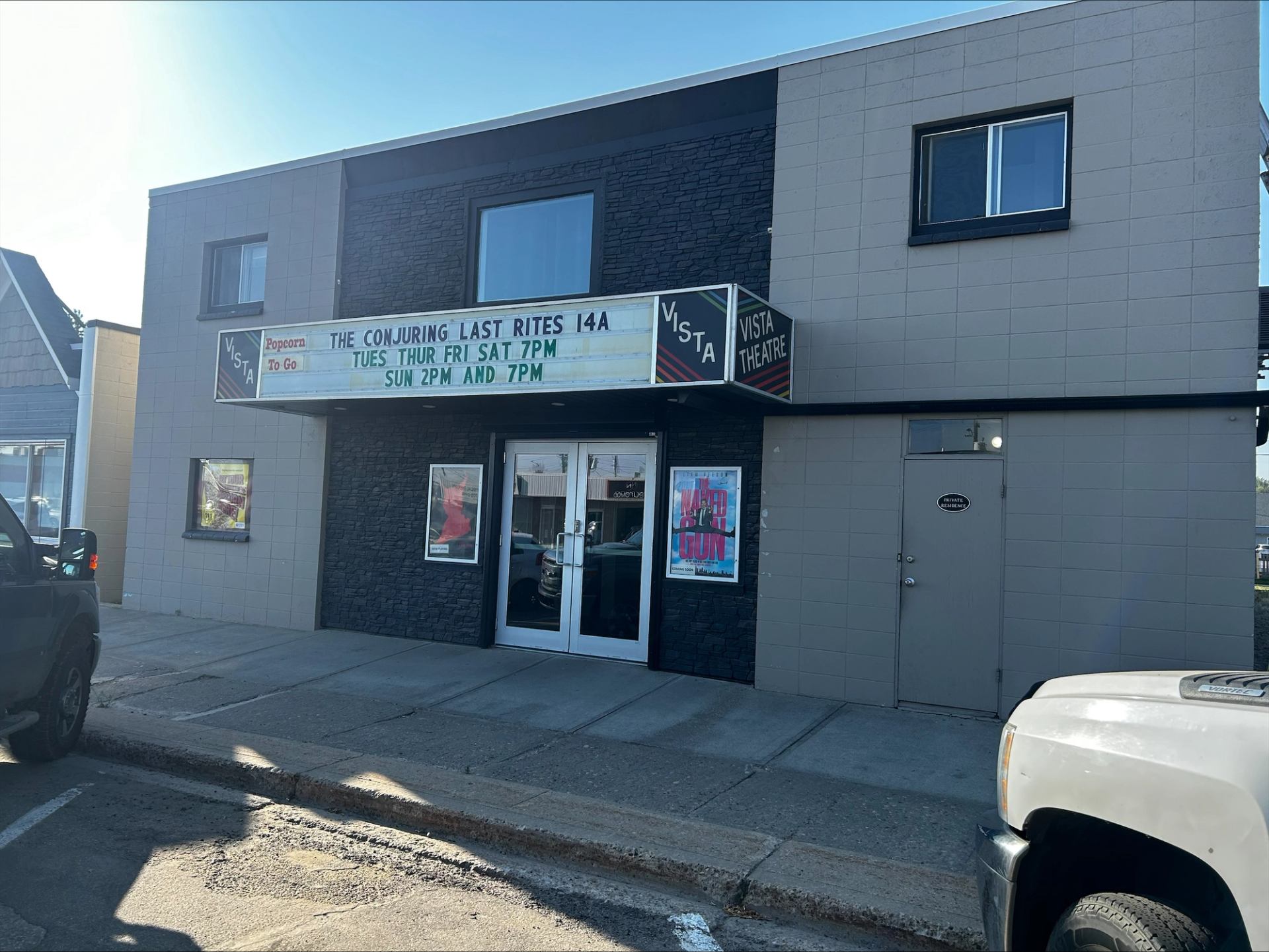 Magic Lantern Vista Theatre with marquee and movie posters.