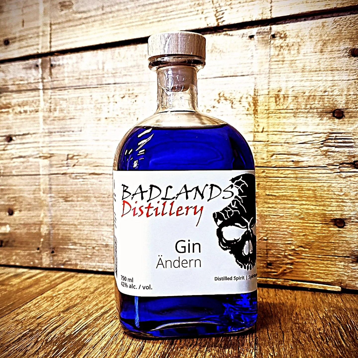 A bottle of blue coloured Gin