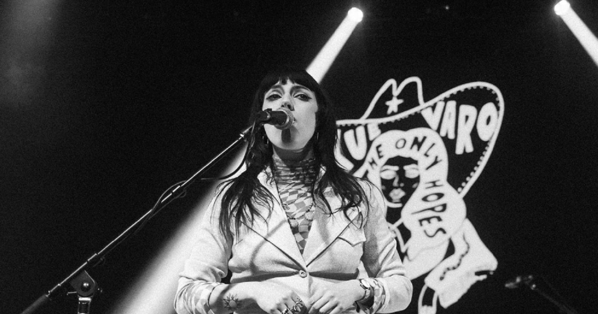 Performer on stage with mic.