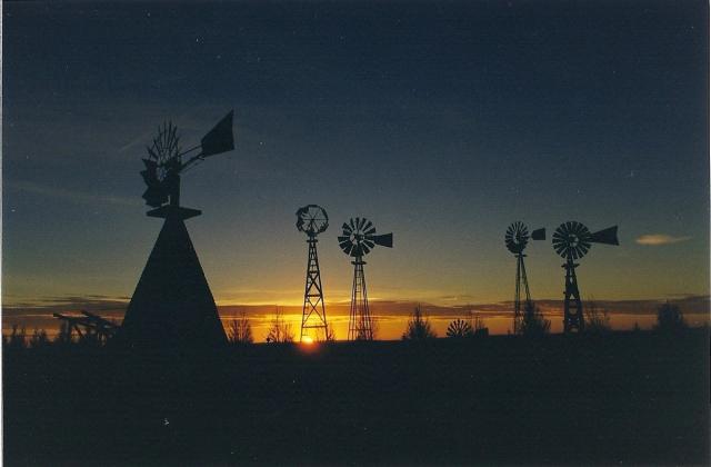 Scenic shot of windmills at sunset.