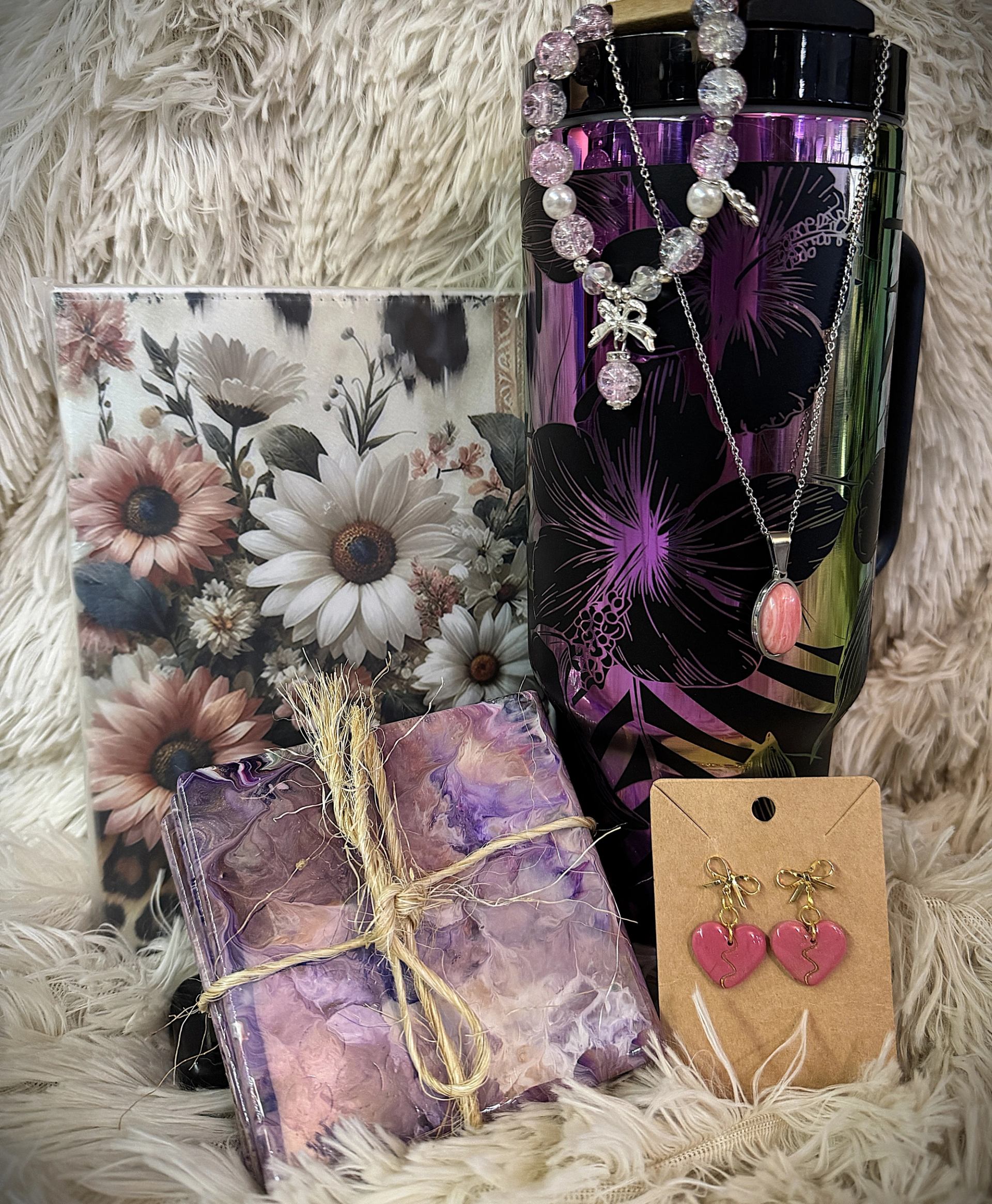 Display of mugs, gift boxes, cutting boards, and decorative items on shelves and a table.