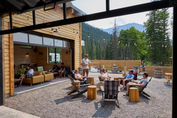 People sitting outside on the patio at Folding Mountain Brewing Taproom and Kitchen.