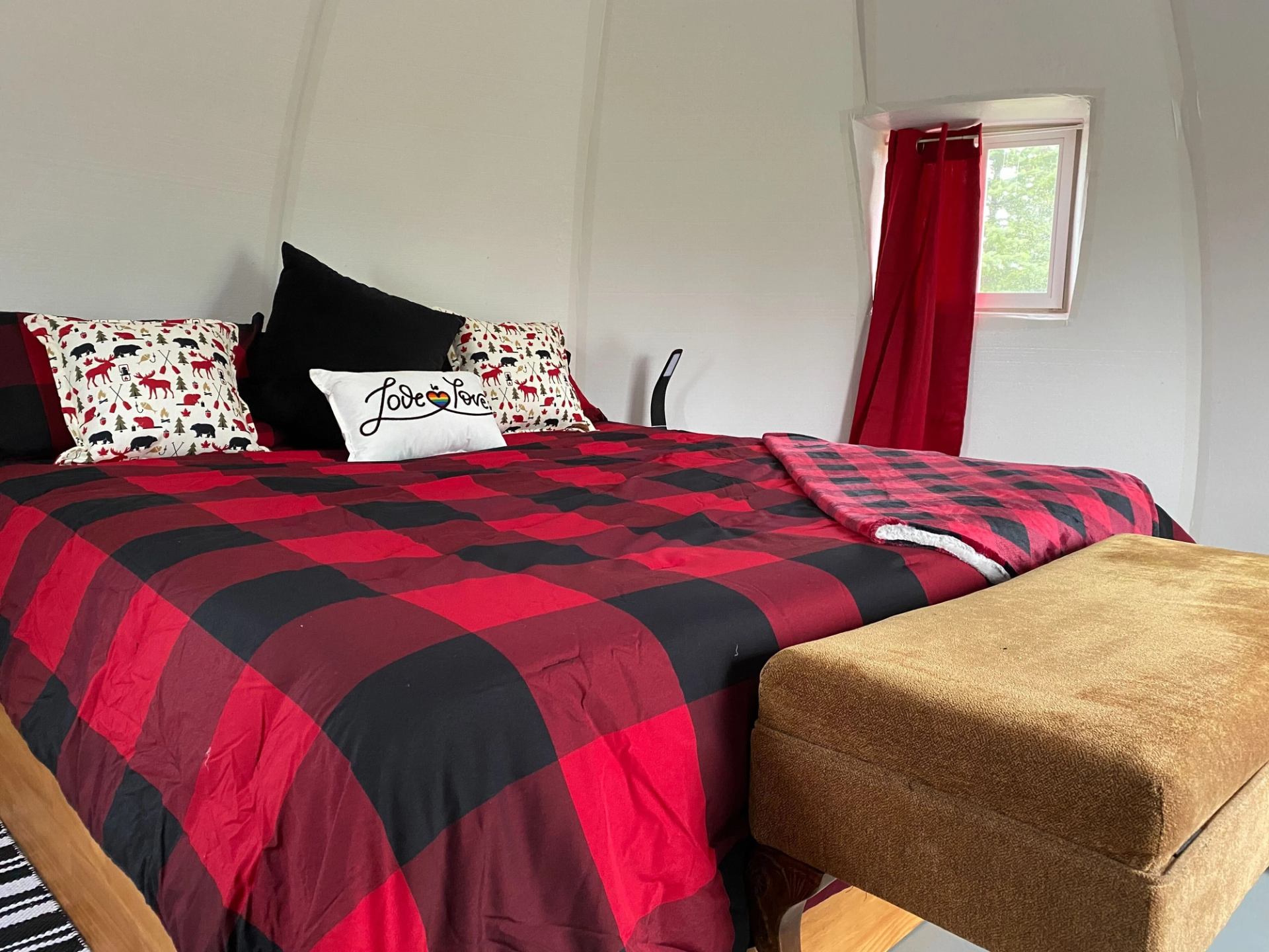 Cozy up in our glamping domes—warm plaid bedding, soft pillows, and peaceful vibes at Rendez-Vous RV Park.