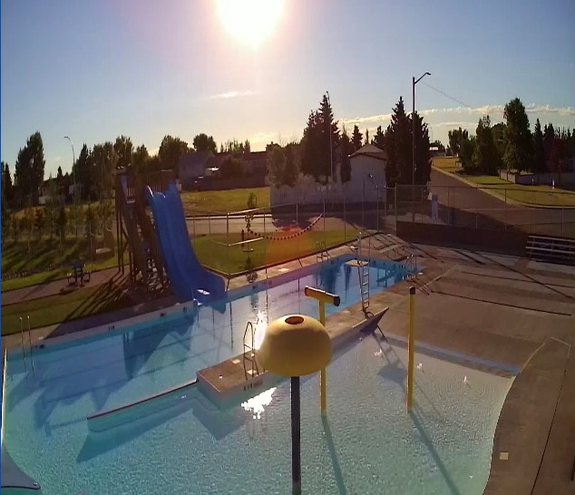 Aerial view of Vauxhall Outdoor Pool with waterslides and splash features.