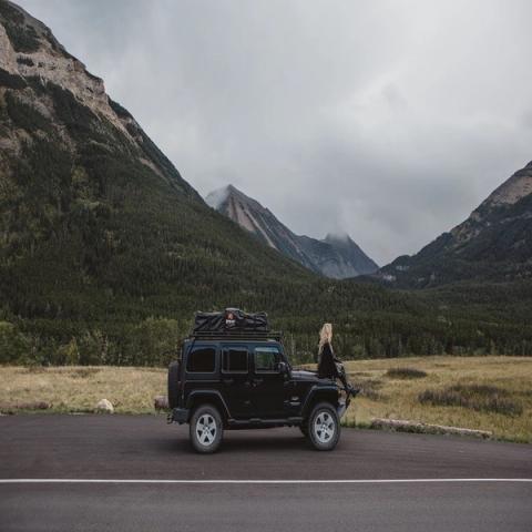 Women sitting on a Jeep near Red Rock Canyon.