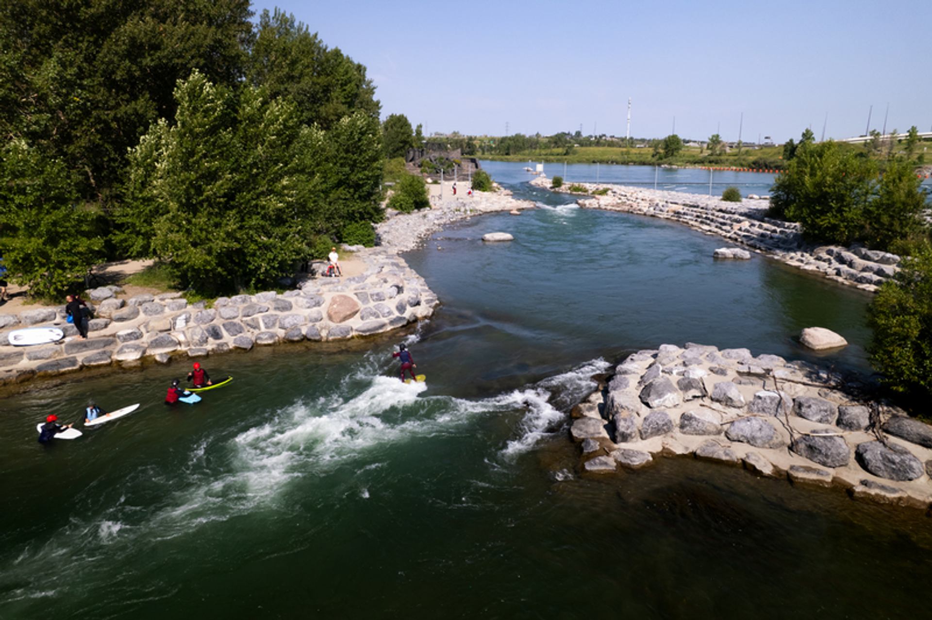 A drone shot of Harvie Passage with river surfers.