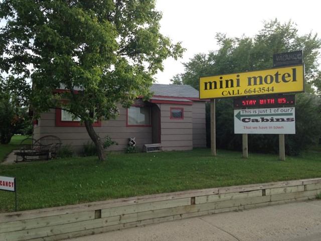 Exterior of the mini motel with signage