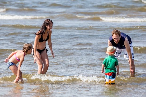 Family playing in the lake at Devonshire Beach.