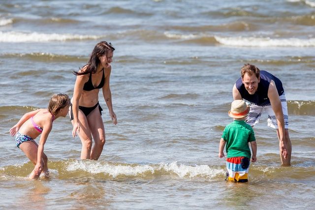 Family playing in the lake at Devonshire Beach.