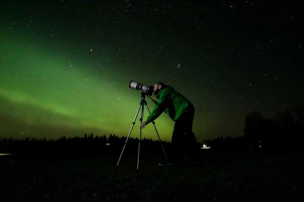 Star gazing under the northern lights at Beaver Hills Dark Sky Preserve in Elk Island National Park.