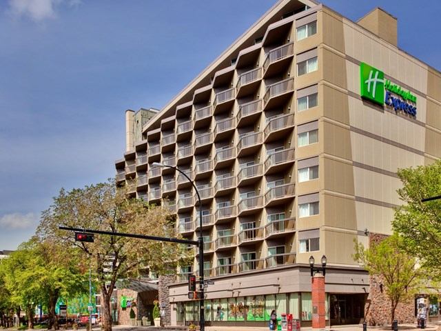 Exterior of Holiday Inn Express with modern design and large windows.