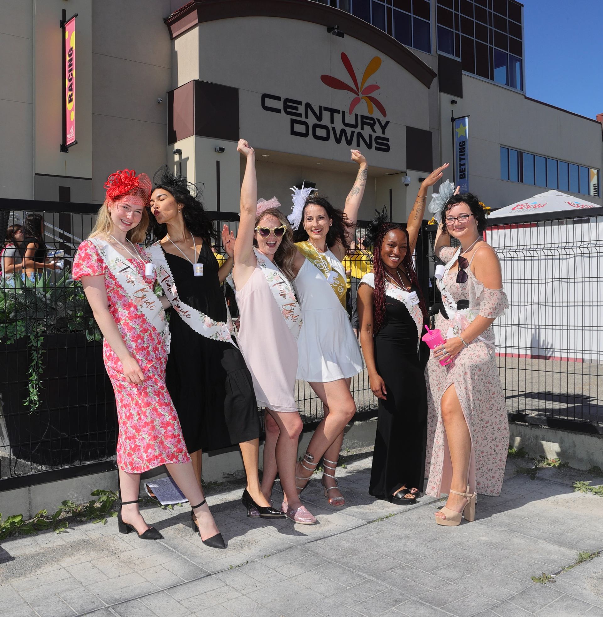Group poses outside Century Downs during Cornstock