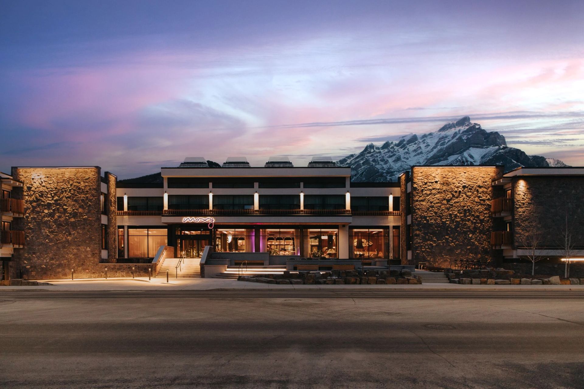 Sunset exterior at Moxy Hotel in Banff.