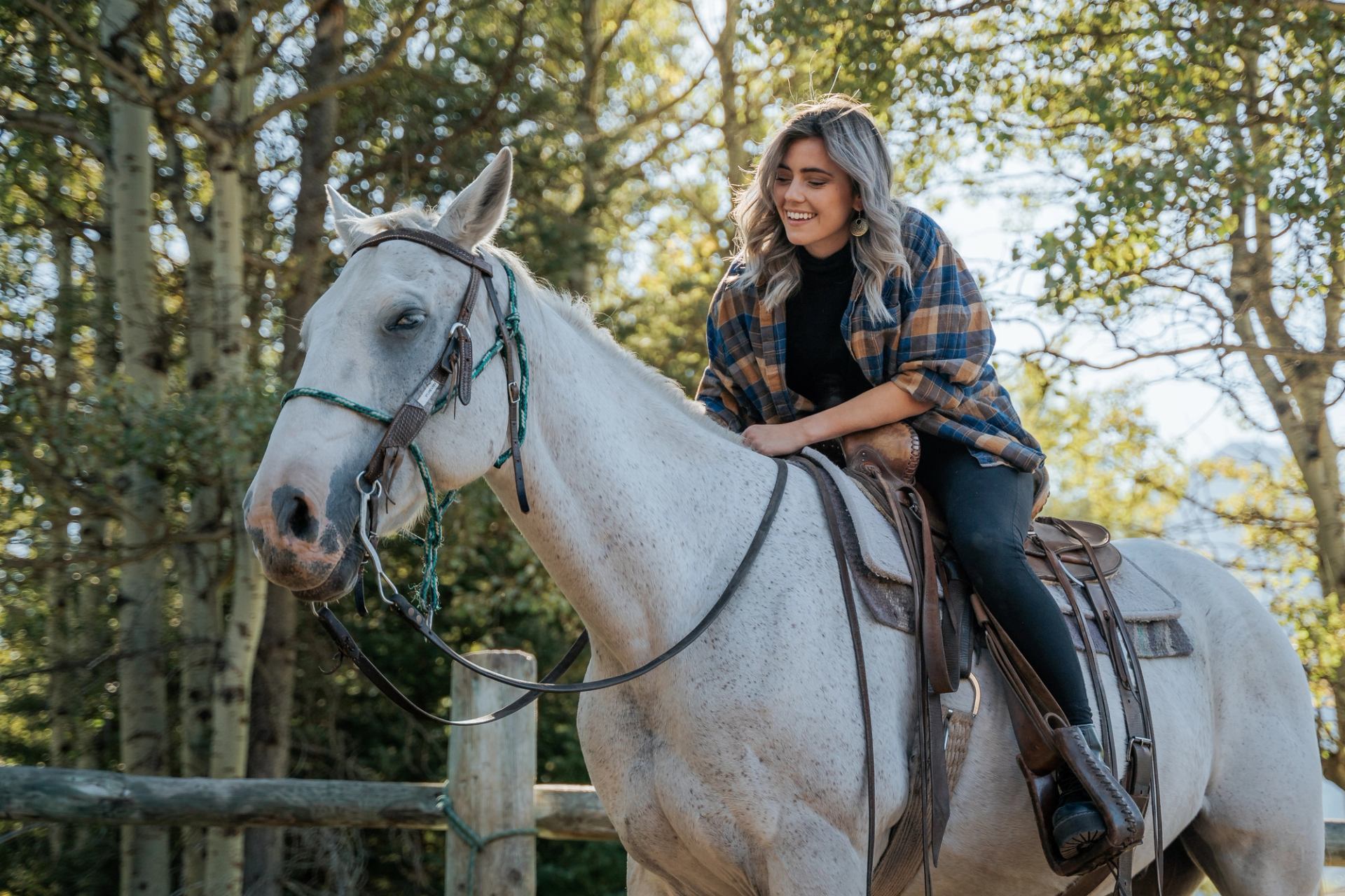 A guest sitting on a saddled horse at Boundary Ranch, preparing to start a guided trail ride