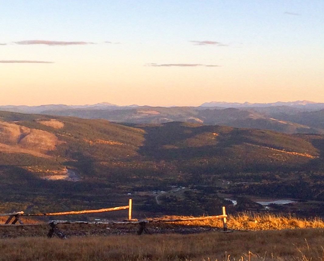 Mountainous landscape with a sunset glow.