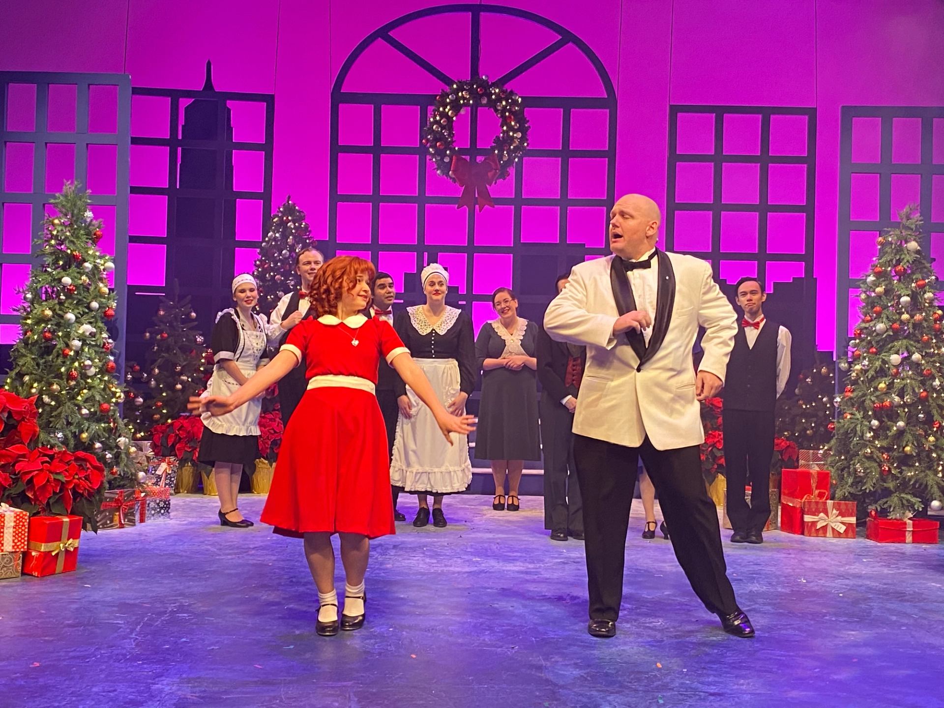 Holiday musical at Storybook Theatre with festive set and performers.