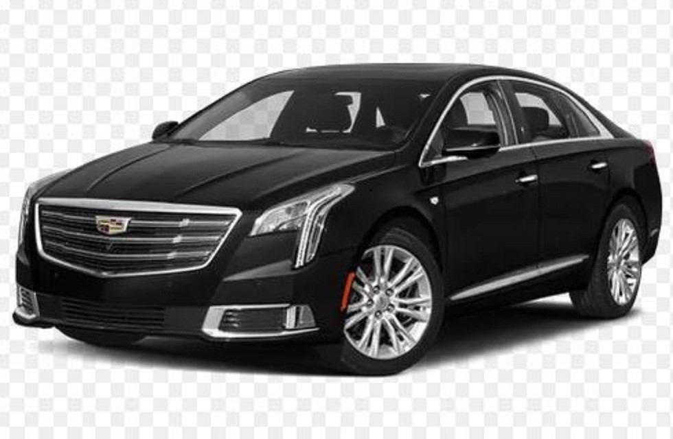 Black Cadillac sedan with chrome accents by Airport Shuttle Express Ltd.