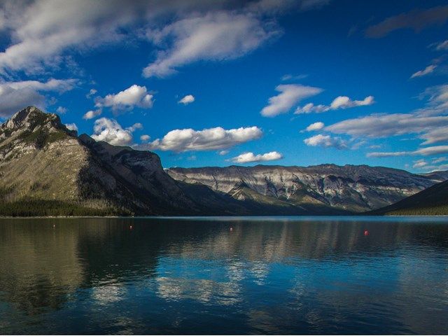 Landscape shot of Lake Minnewanka with the mountains in the background.