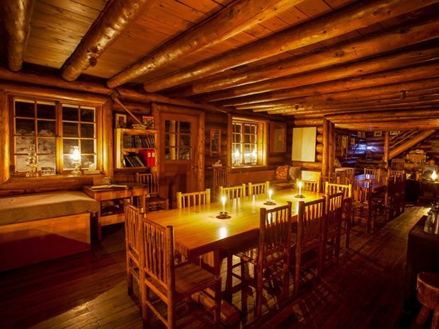 Interior shot of Skoki Lodge at night.