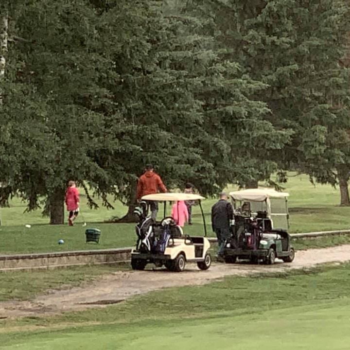 People riding around in golf carts.