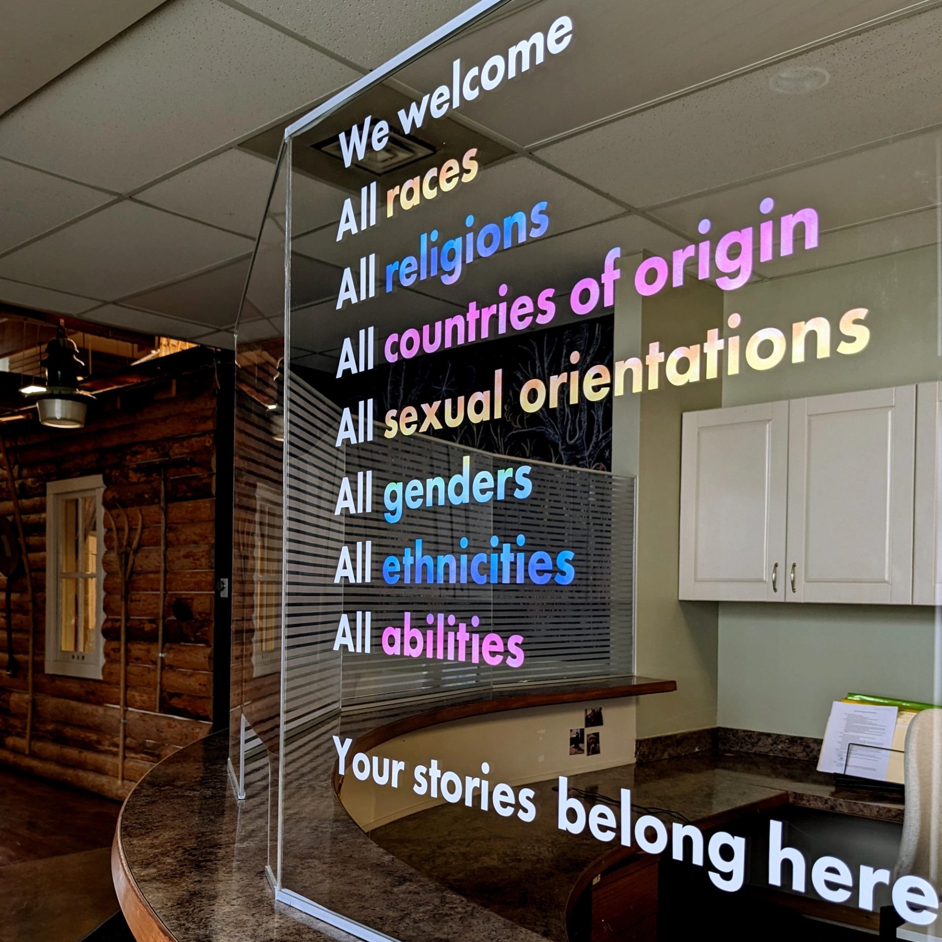 Inclusivity sign at Strathcona County Museum & Archives reception area.