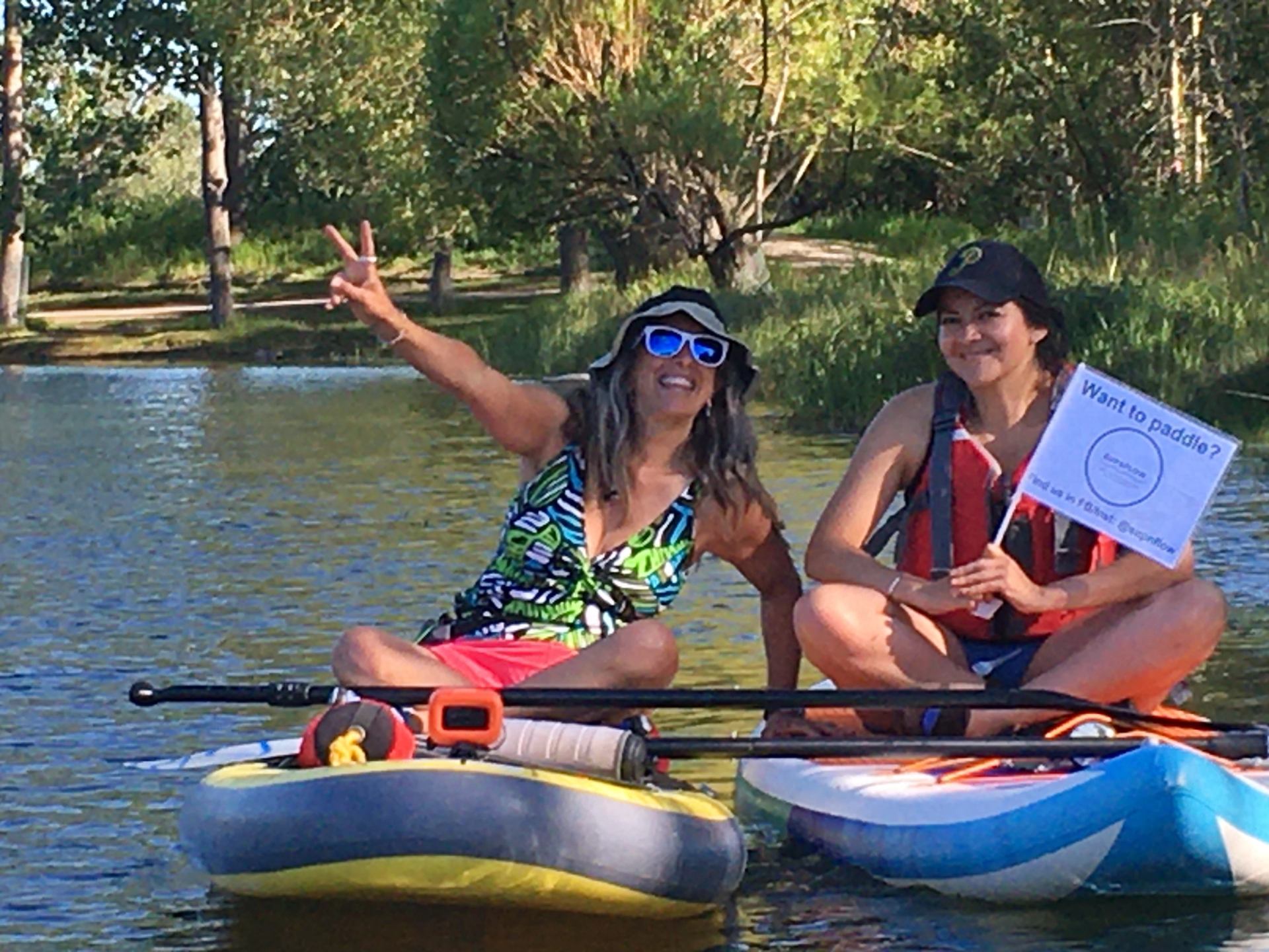 Two people floating on SUP
