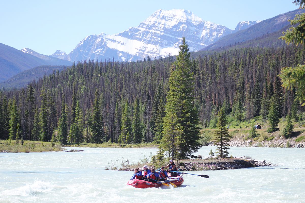 A group of people rafting down the scenic Athabasca Expressway