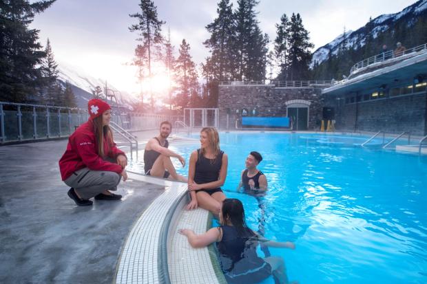 A group of visitor enjoying the hot springs in Banff.