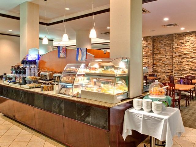 Breakfast area with food displays and seating.