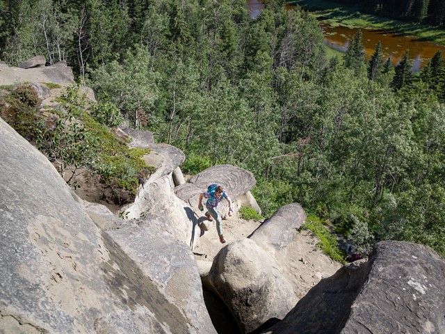 Man hiking in Sundance Provincial Park at the Hoodoos of the North.