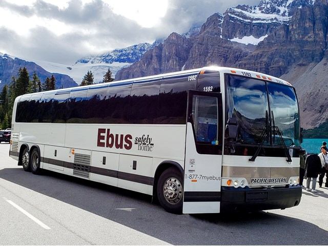 Ebus with scenic forest background.