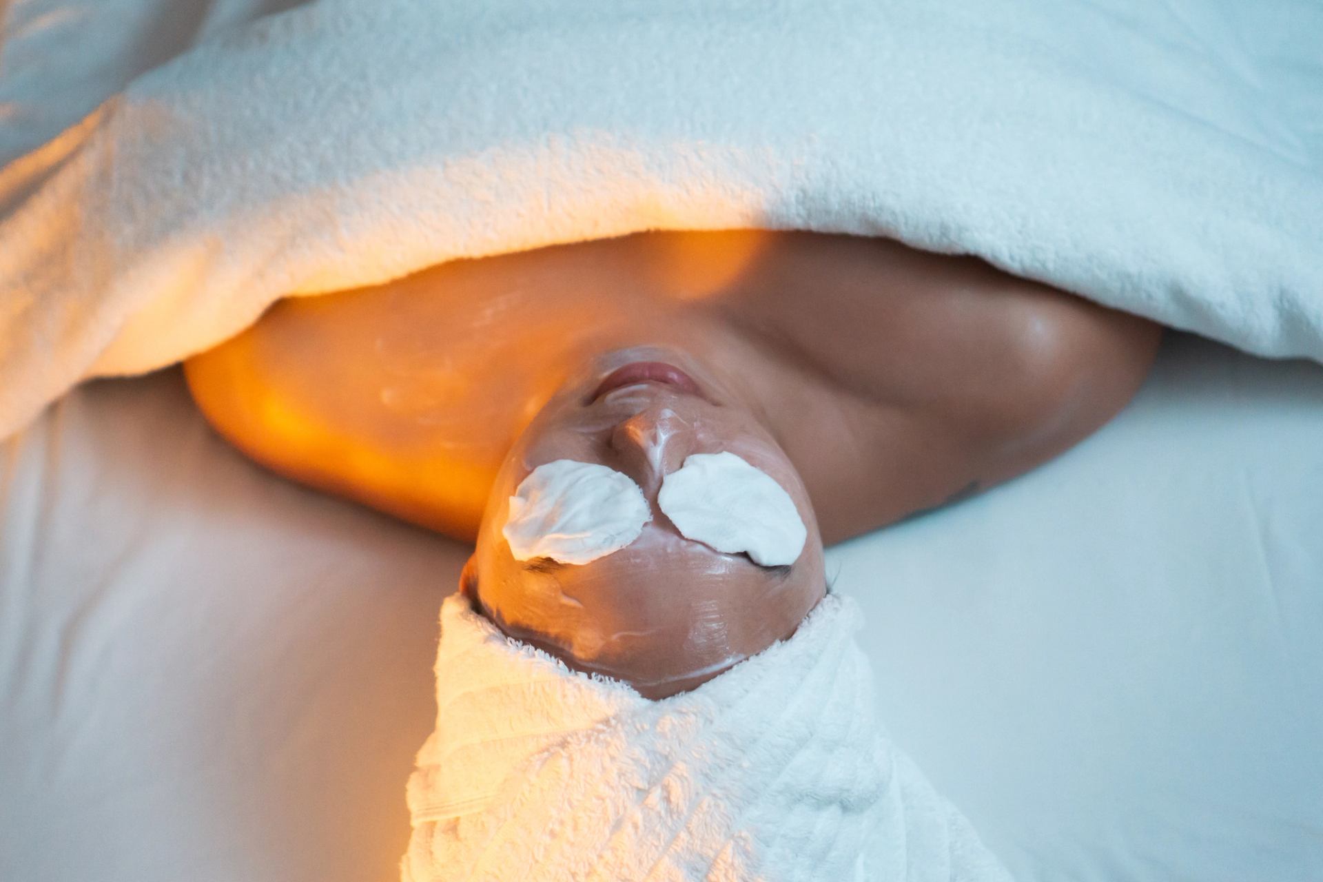 A woman relaxes on a massage table at Spa Jasper.