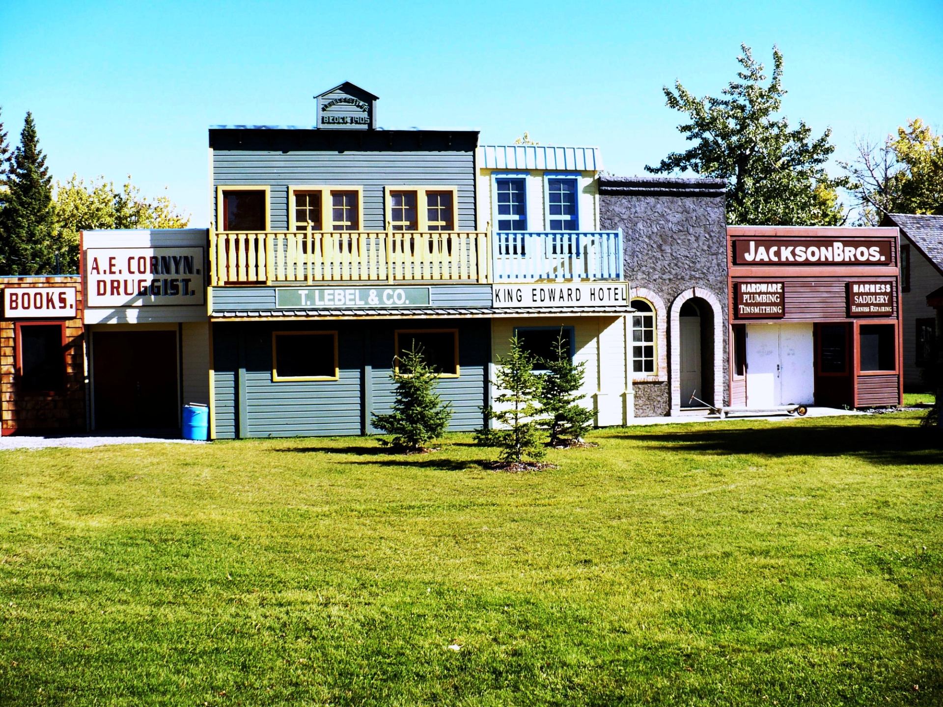 Western-style buildings near Pincher Creek VIC with grassy area and trees.