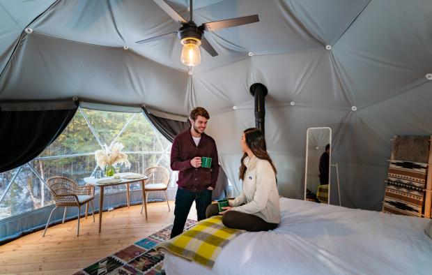 Couple inside a tent at Elk Island Retreat.