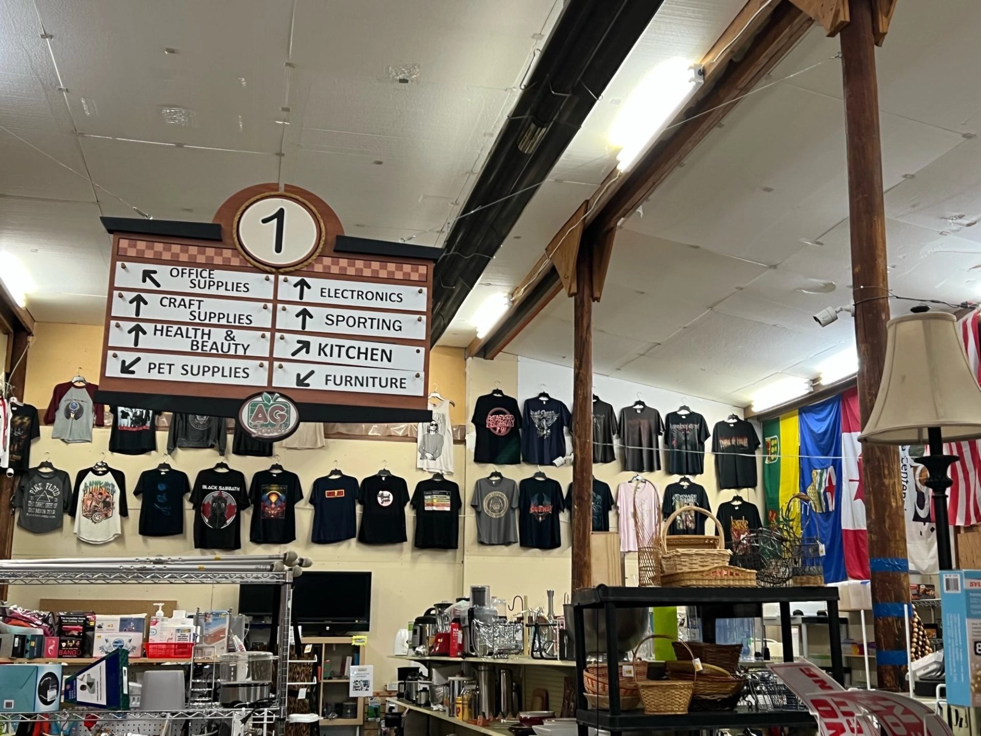 Interior of The Treasure Chest with hanging graphic T-shirts and shelves of assorted goods.