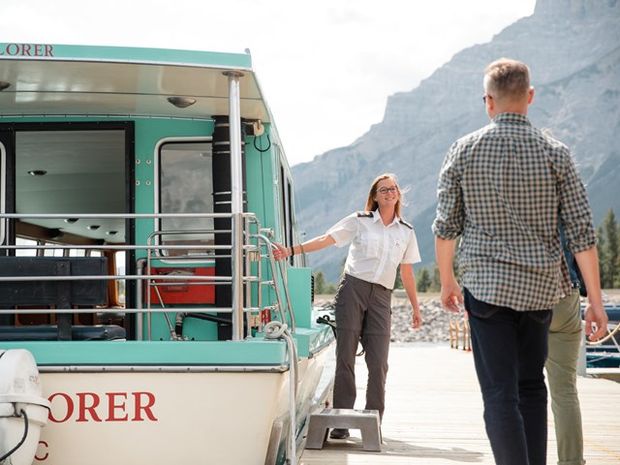 Guests being welcomed on to a Lake Minnewanka Cruise.