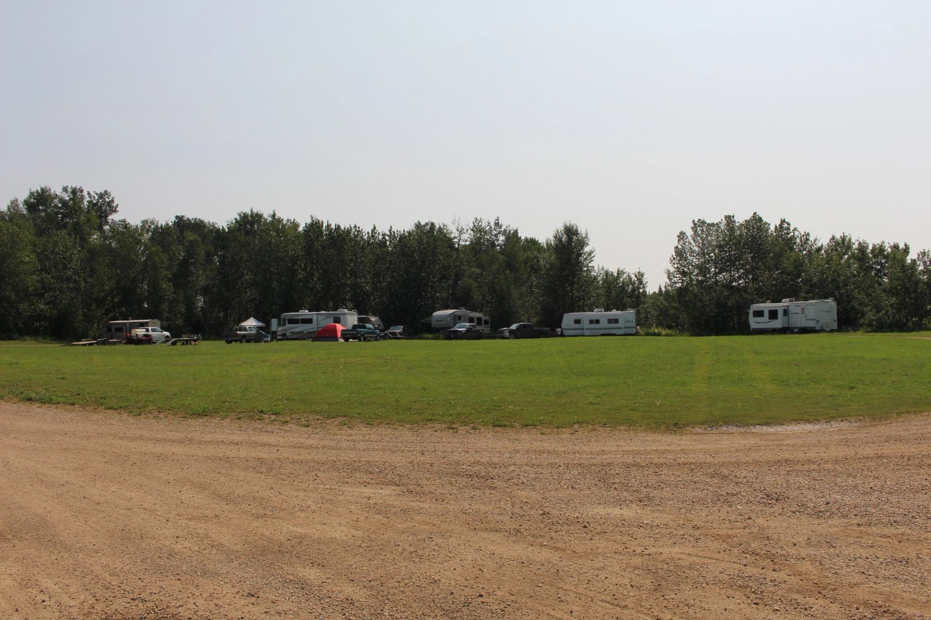 RVs parked in campsites at Heart River Dam Provincial Recreation Area.