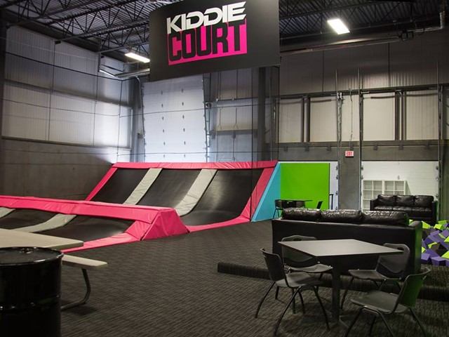 Kiddie Court trampolines with seating area designed for younger children.