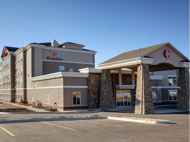 Exterior of Ramada Drayton Valley with stone accents and visible logo.