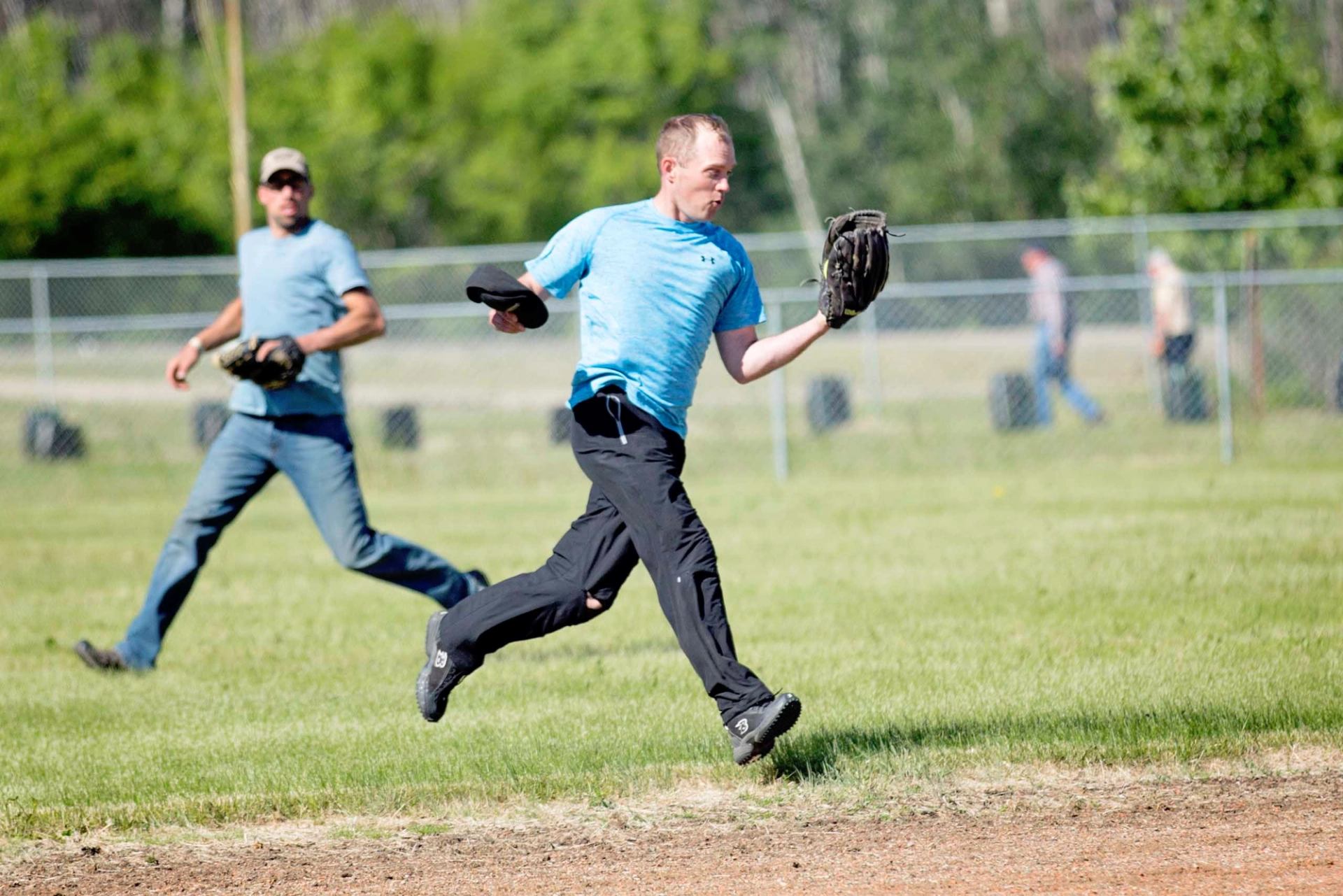 A couple of men playing baseball.