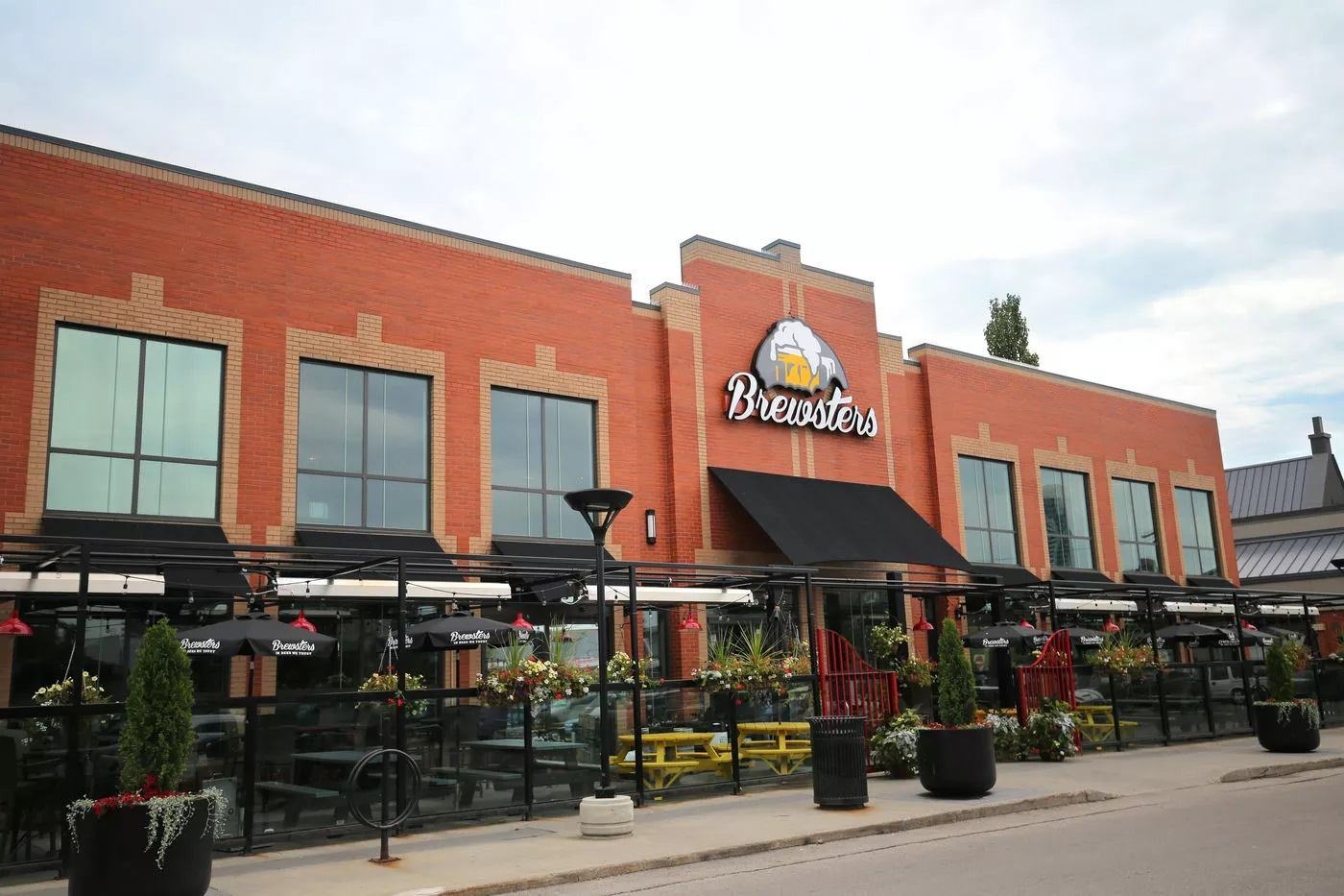 Exterior of Brewsters with a patio along the front of the building